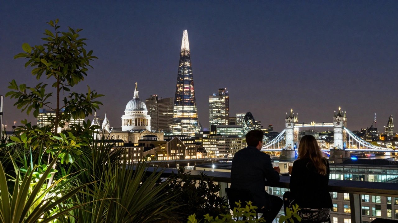 Night view from Sky Garden showing London’s skyline lit up, silhouettes on terrace.